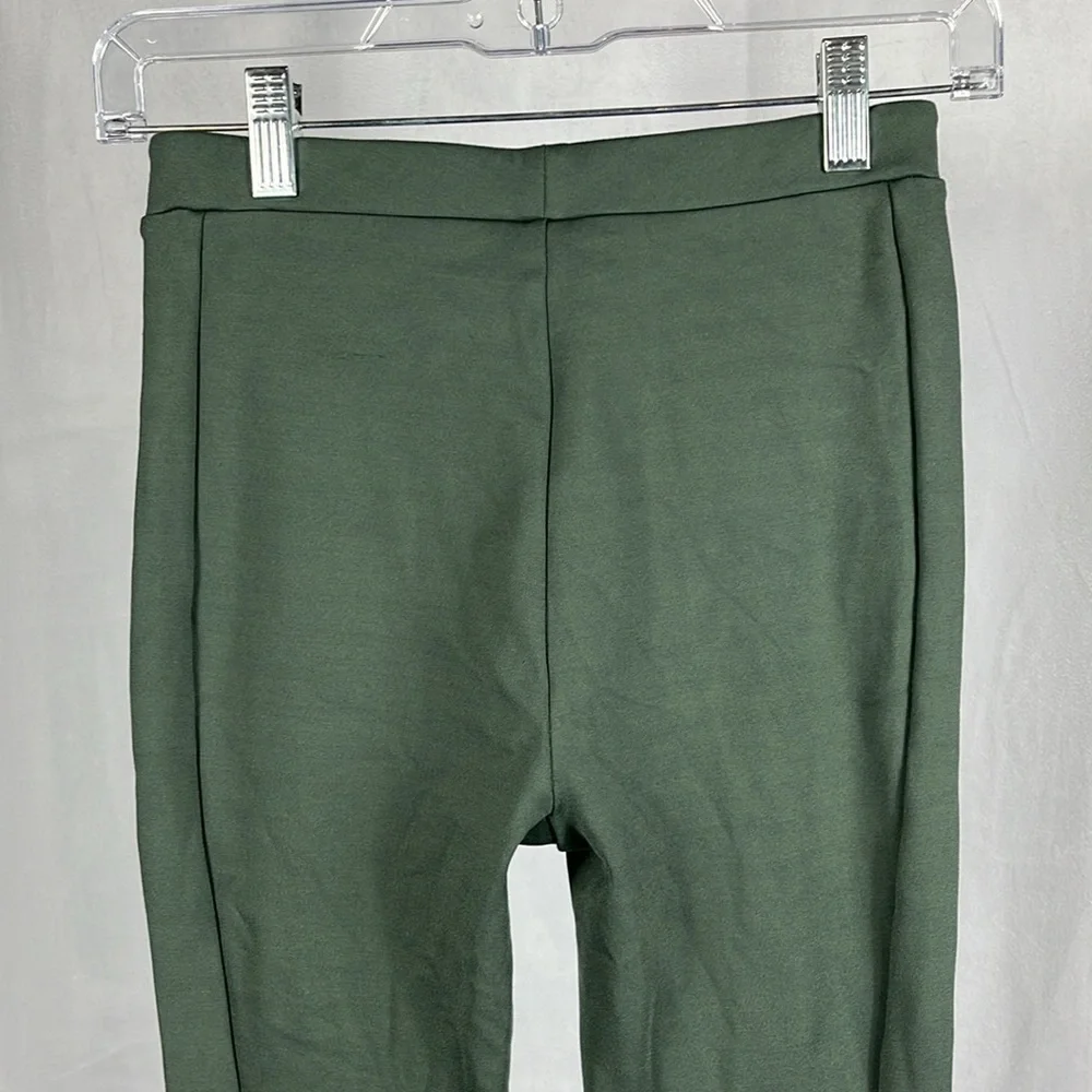 Alo‎ Yoga High-Waist Zip it Flare Legging in Dark Cactus Green.
